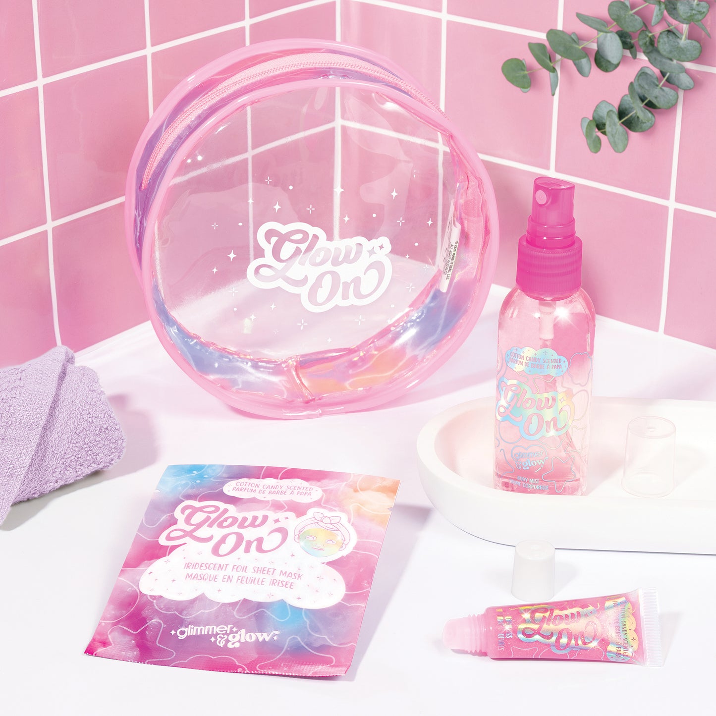 Glimmer & Glow beauty bag set with pink mist, sheet mask, lip gloss and clear case