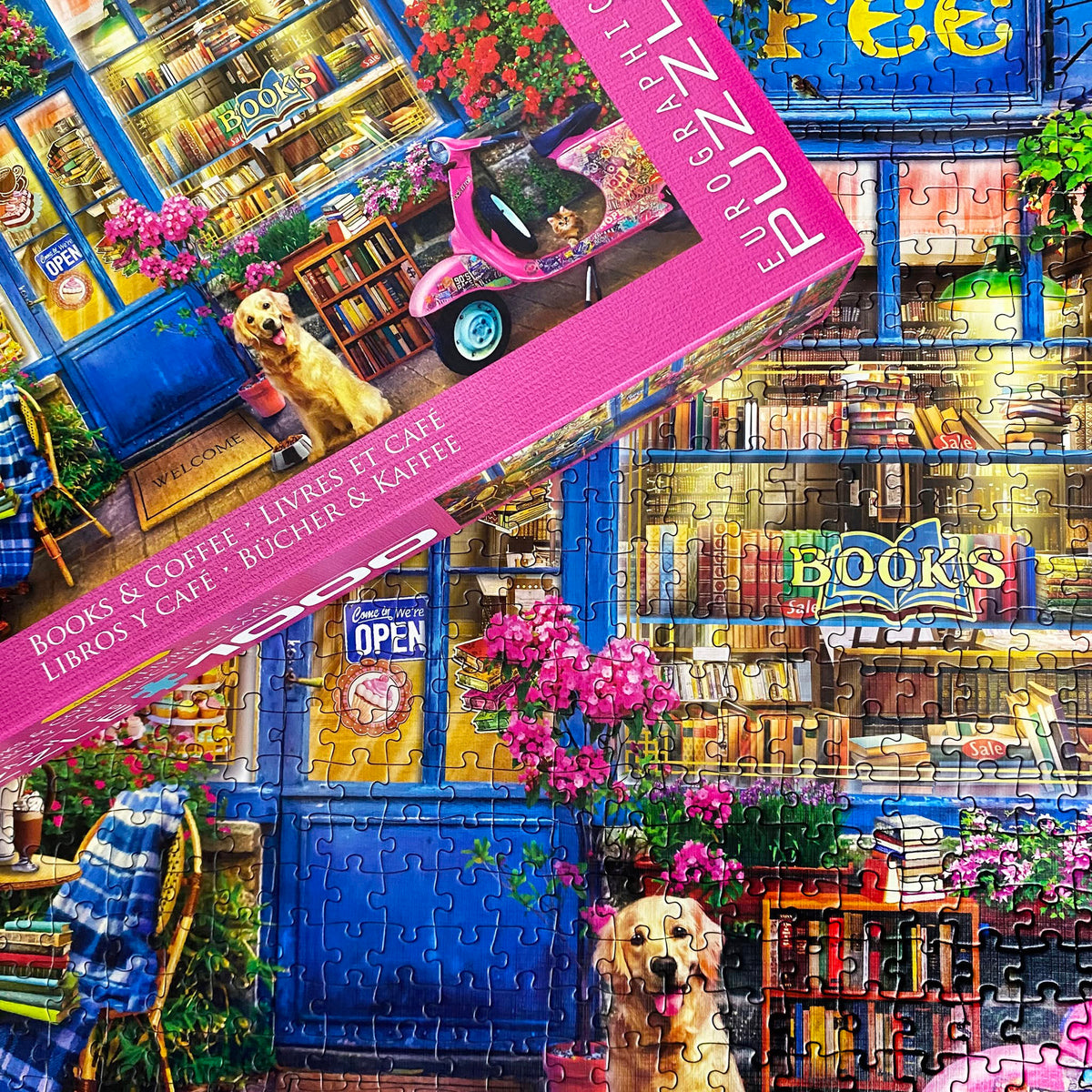 Eurographics Books & Coffee 1000 piece puzzle featuring colorful bookstore café scene with blue storefront and pink f...