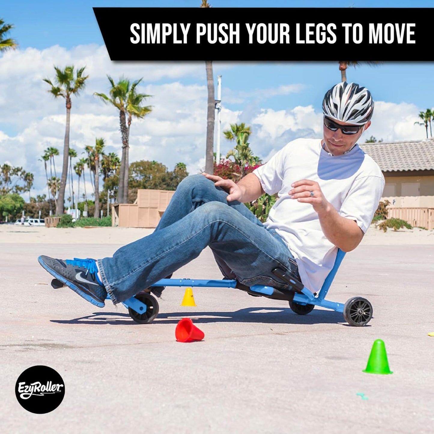 EzyRoller Pro X blue pedal-free ride-on with hand brakes, boy riding outdoors