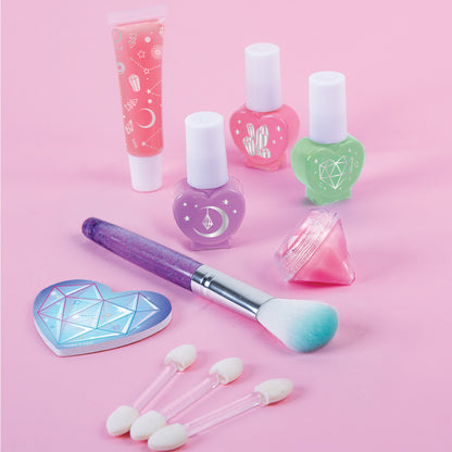 Glimmer & Glow Cosmetic Studio kids makeup set with purple nail polish, pink lip gloss, green nail polish, heart-shap...