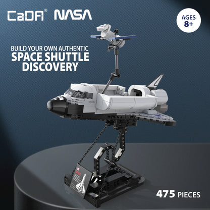 CaDA NASA Space Shuttle Discovery 475-piece building set with white and black shuttle, satellite, and display stand