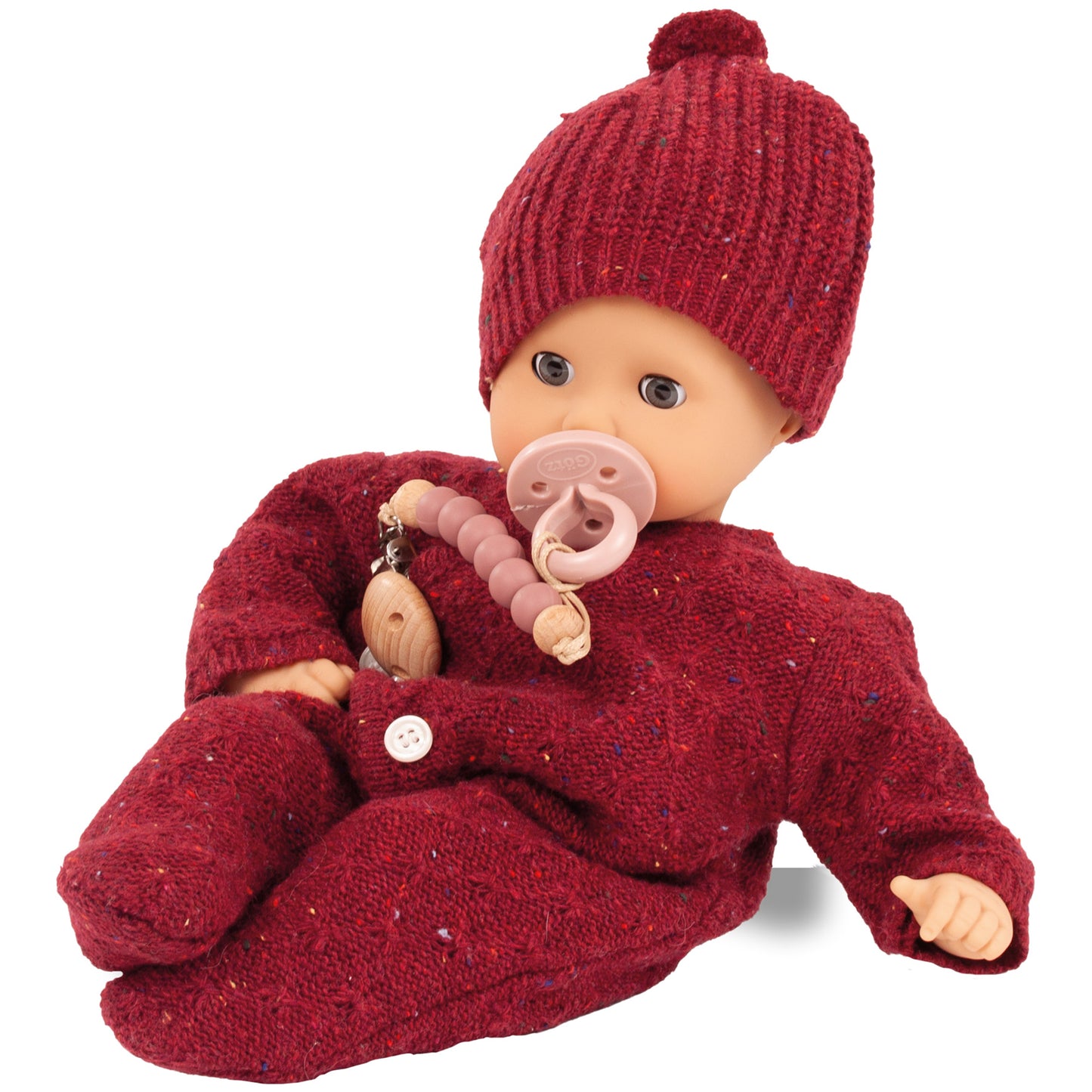 Jubilee Muffin Baby 13 inch soft doll wearing burgundy knit outfit and hat with pacifier