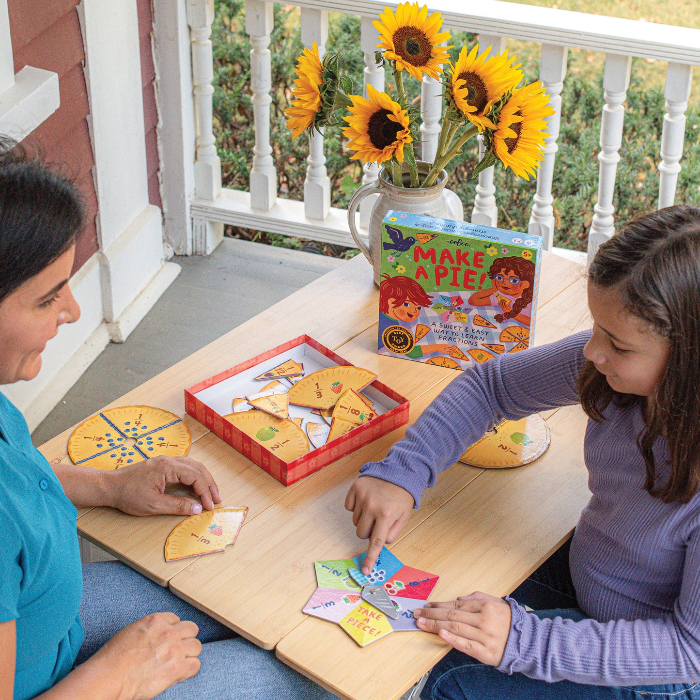 Make A Pie Game with colorful pie-shaped cards and box displayed on wooden table