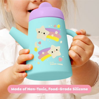 Tiger Tribe silicone tea set with turquoise cup, pink lid, and cute star designs, held by toddler hands