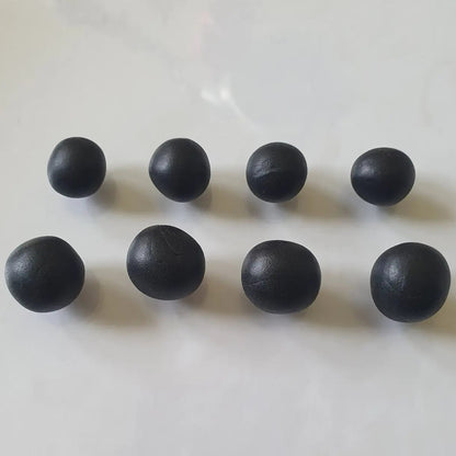Sculpey Premo Clay Black 1lb - Eight dark black clay balls displayed