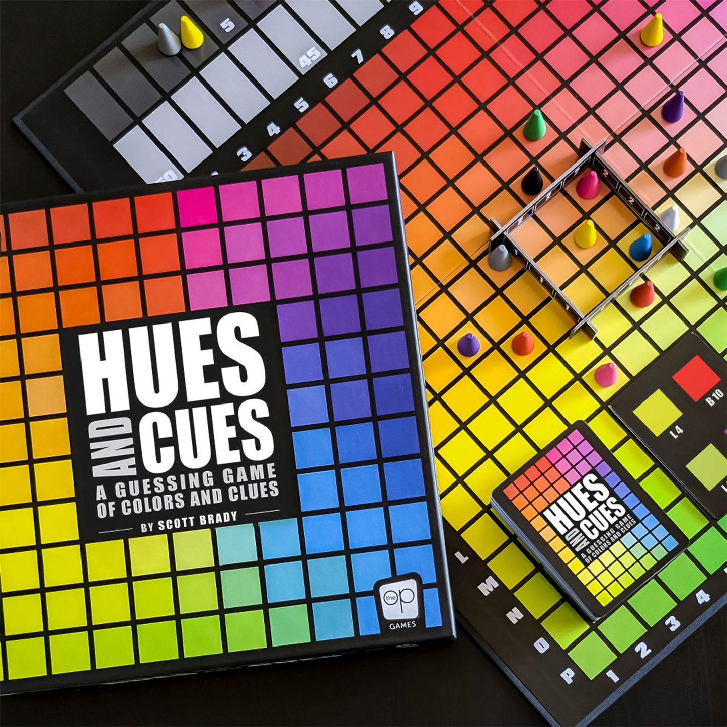 Hues & Cues board game with colorful grid, game pieces, and instruction cards displayed