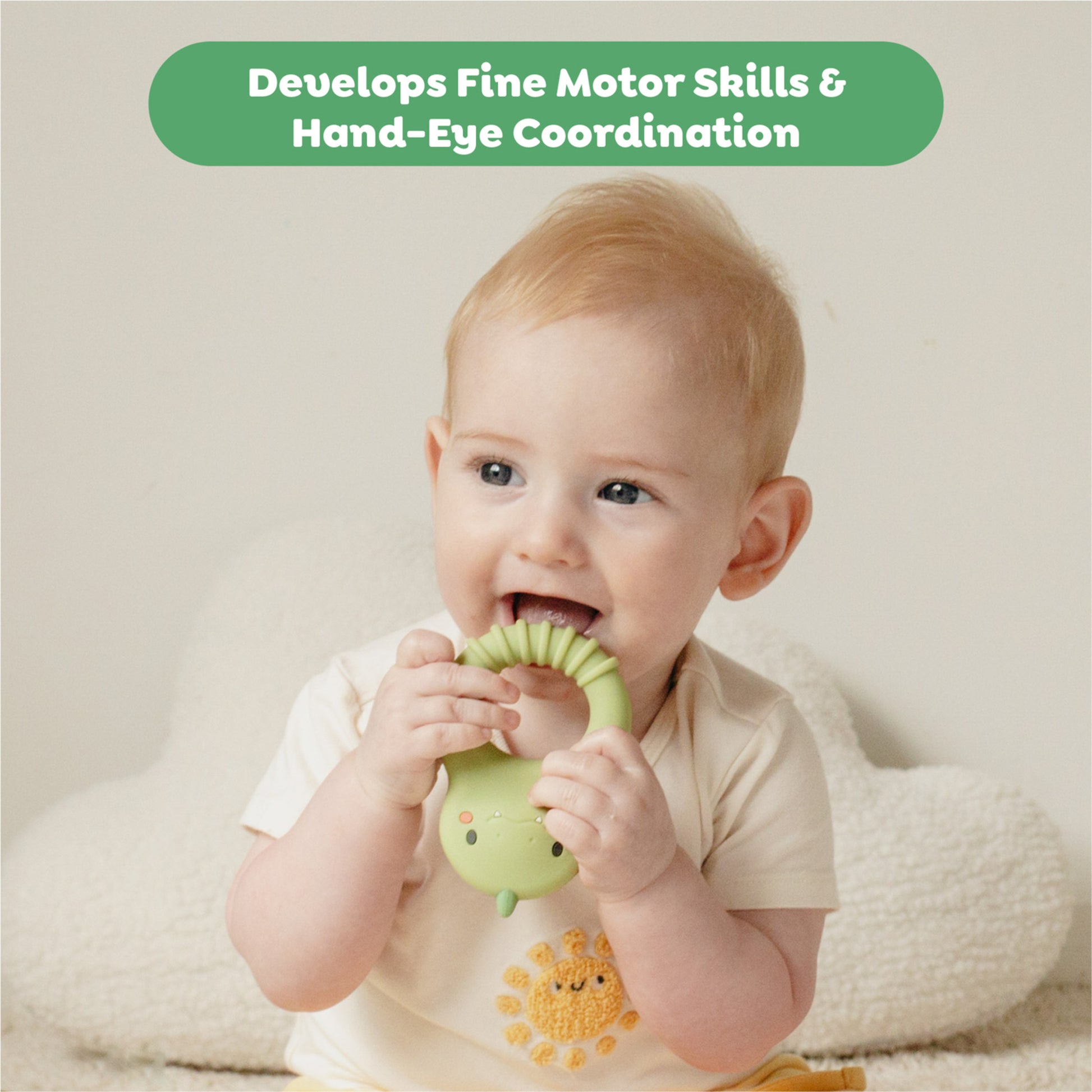 Tiger Tribe Dino Silicone Teether in green and pink, baby chewing toy for sensory play