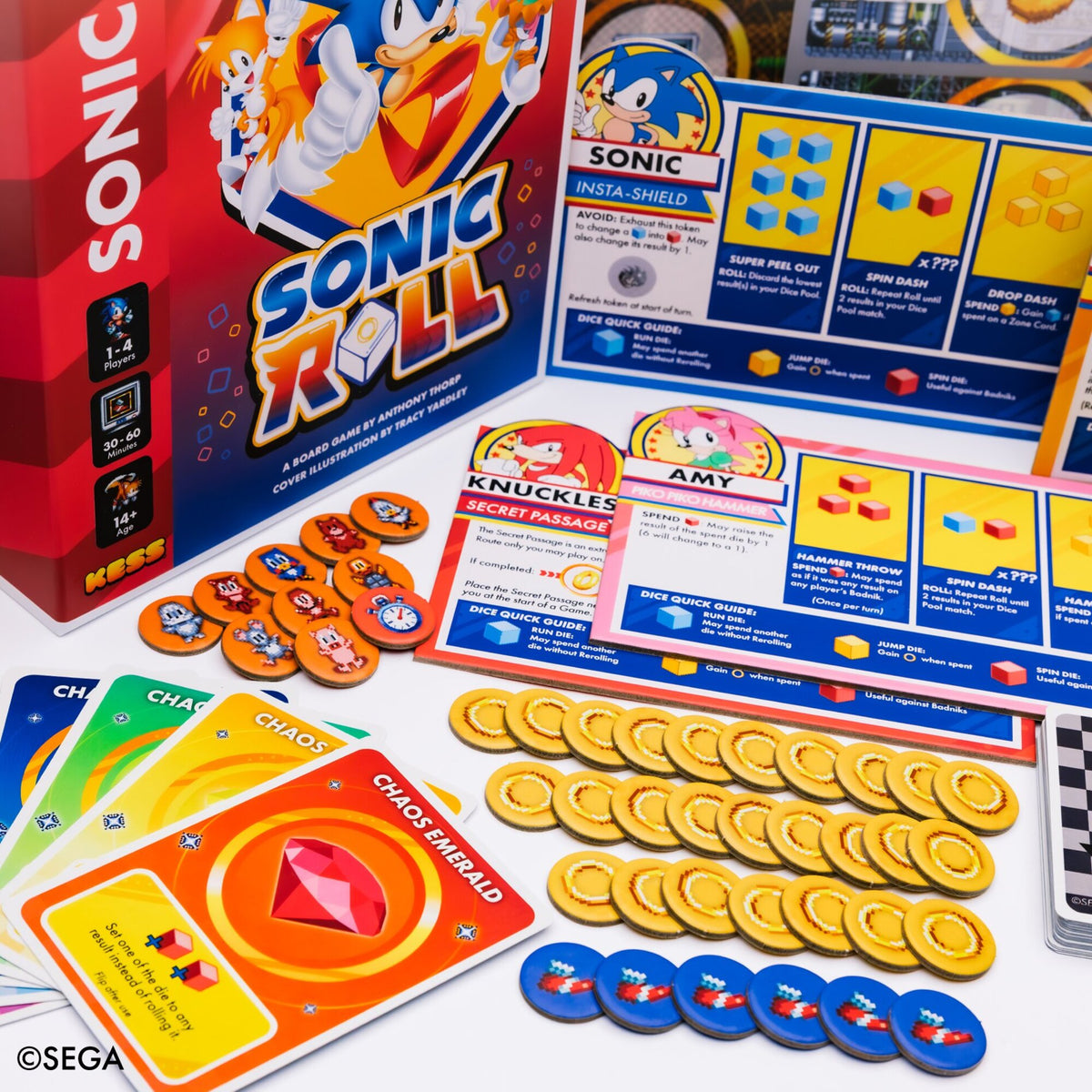 Sonic Roll board game with character cards, dice, tokens, and game board featuring yellow rings and blue chaos emeralds