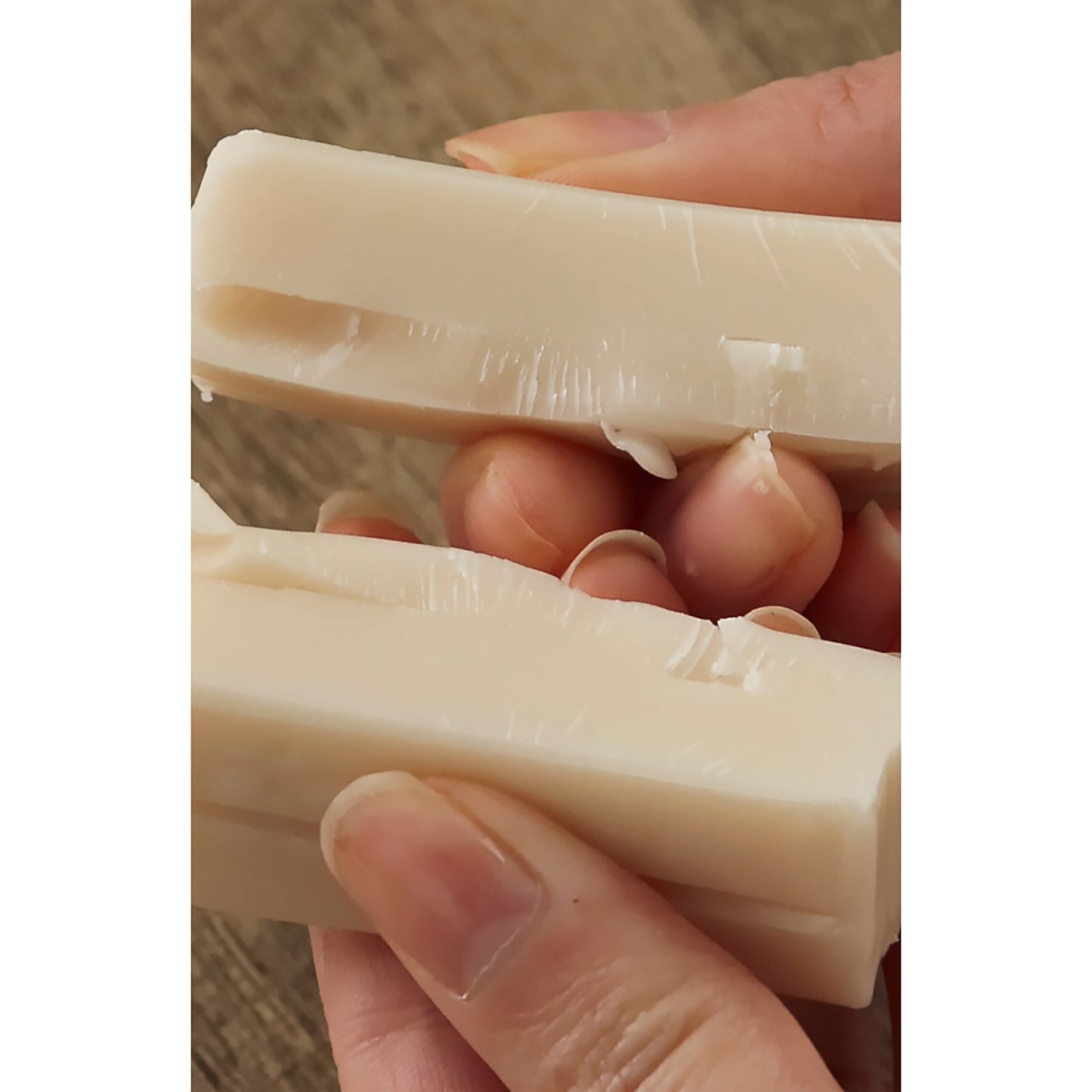 Sculpey Premo Translucent Clay 1lb being held, showing flexible beige polymer clay