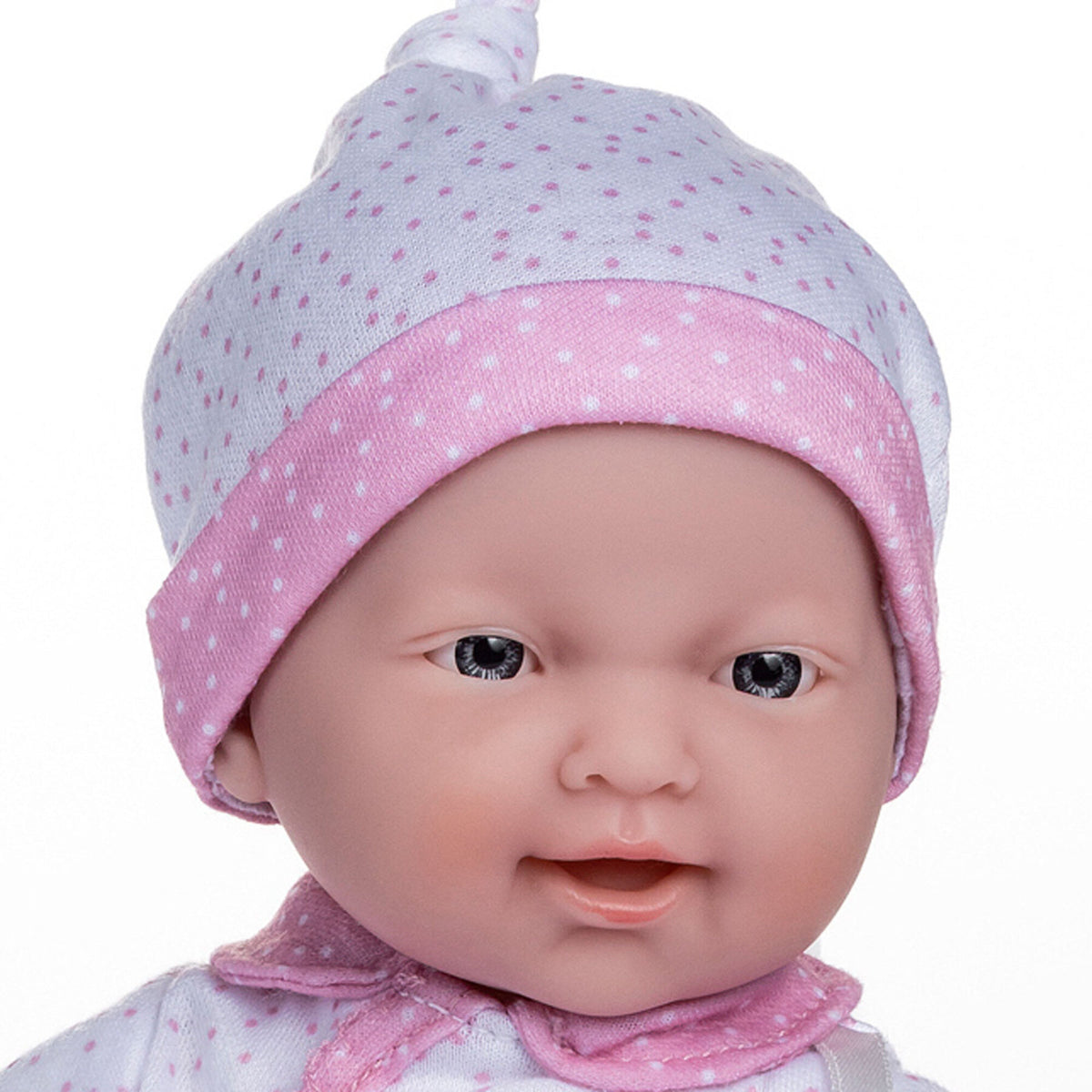 JC Toys La Baby Caucasian doll wearing pink and white polka dot outfit and hat