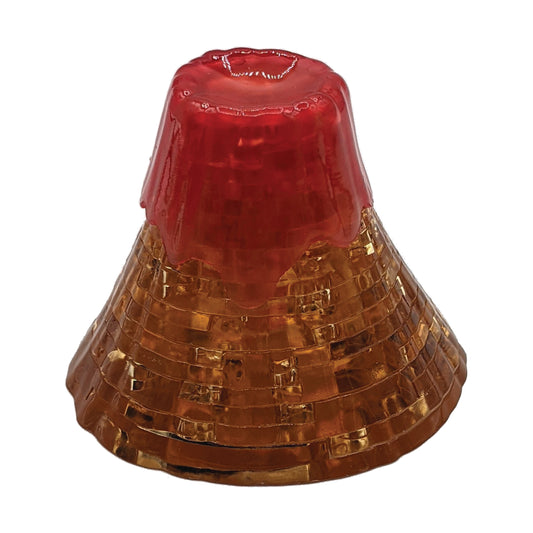 Red and gold 3D crystal puzzle volcano assembled on white background