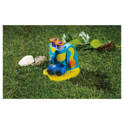 GeoSafari Jr. My First Microscope in blue and yellow on grass with shells