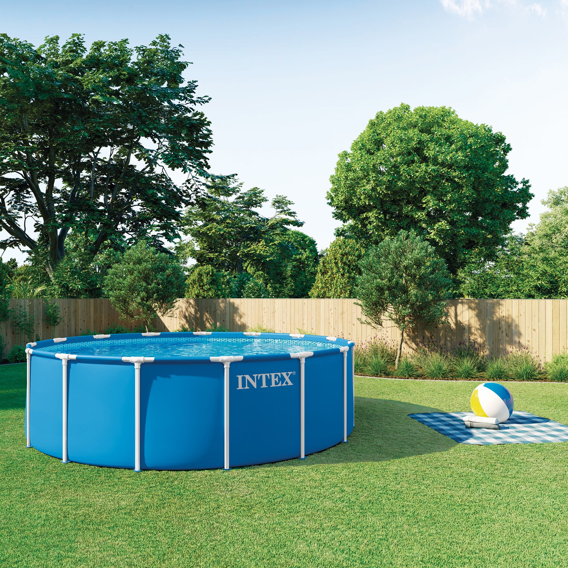 Intex 15' x 48" metal frame pool set with blue vinyl, filter pump, ladder and cover in backyard