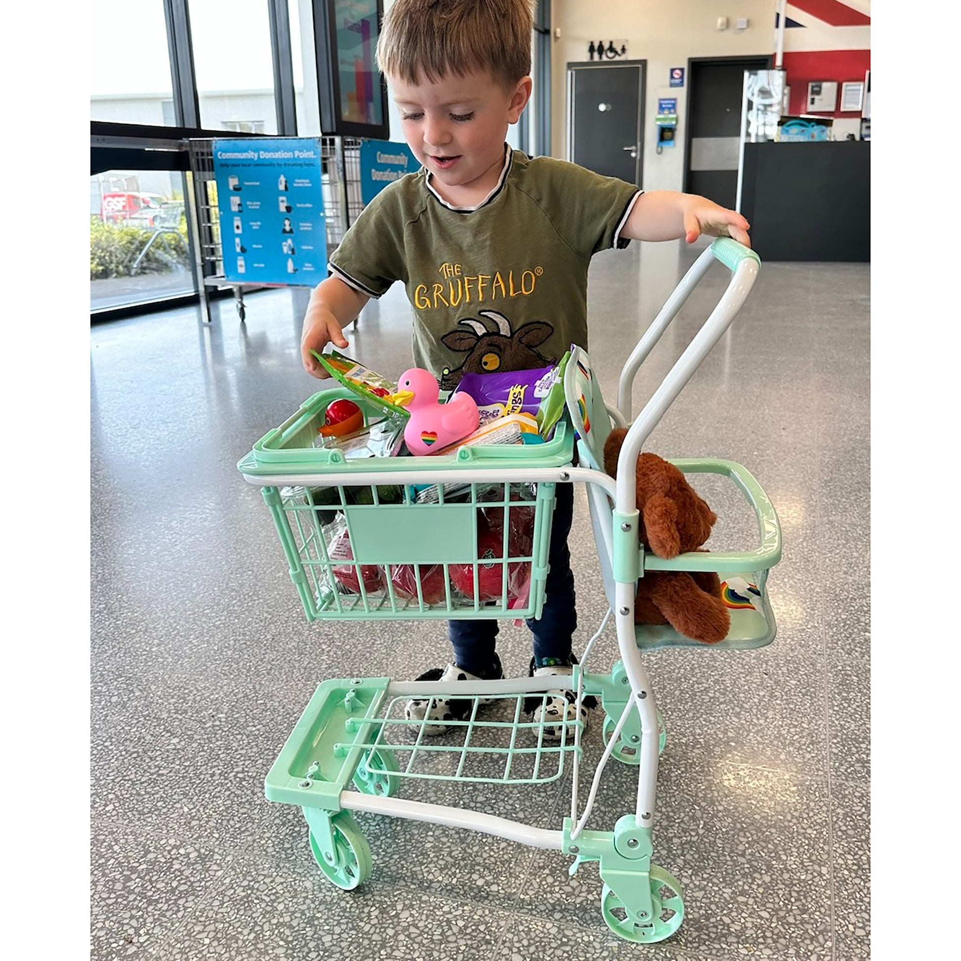 Roma Rupert Shopping Trolley in mint green with child playing, includes toy accessories