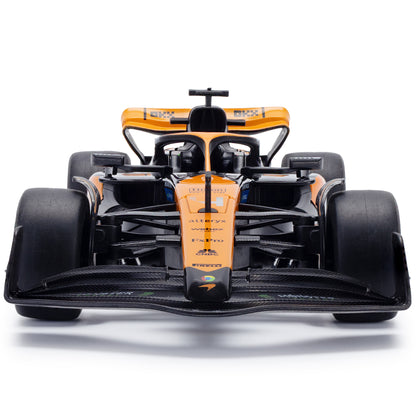 CMJ RC Car 1:20 Scale McLaren F1 orange race car with black details, front view