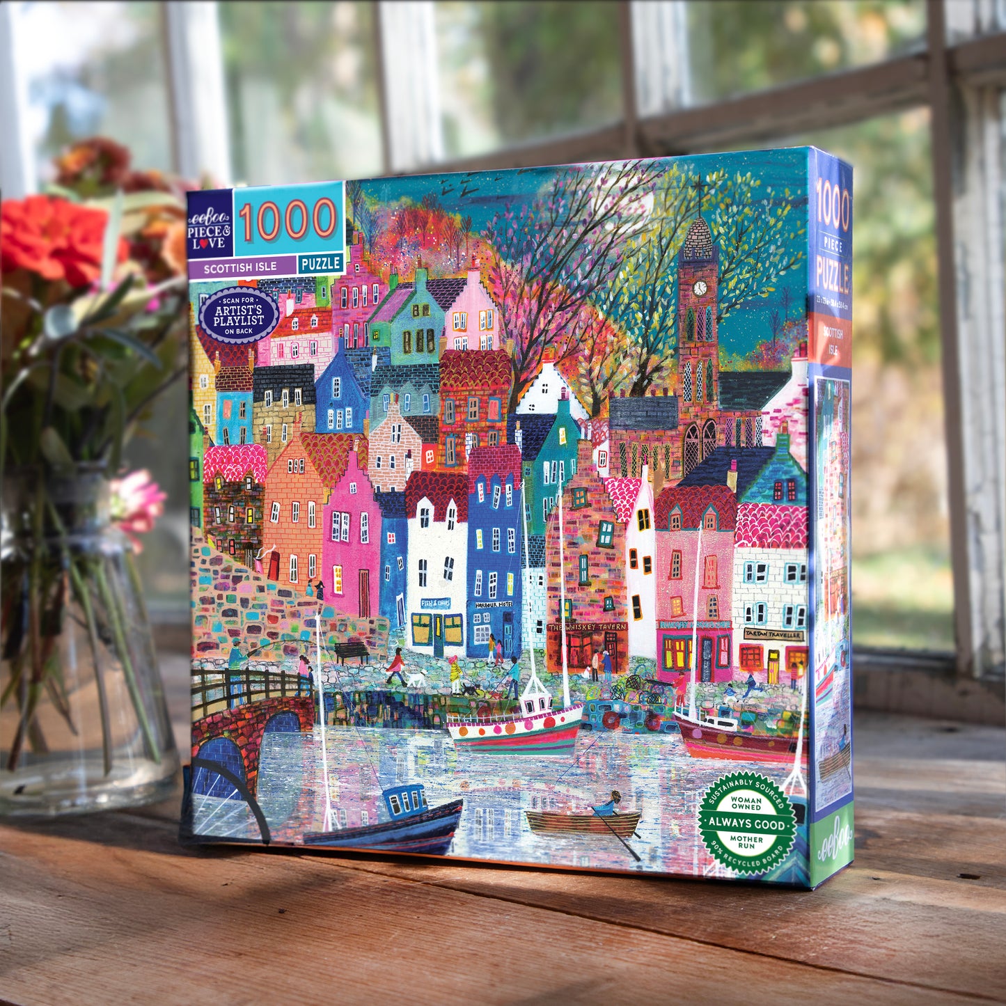 Piece&Love Scottish Isle 1000 piece puzzle box featuring colorful village houses, boats, and Big Ben in vibrant colors