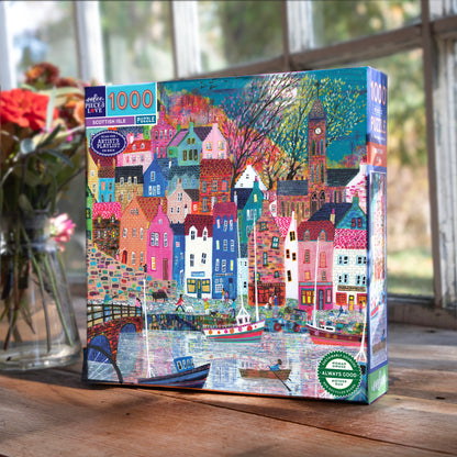 Piece&Love Scottish Isle 1000 piece puzzle box featuring colorful village houses, boats, and Big Ben in vibrant colors
