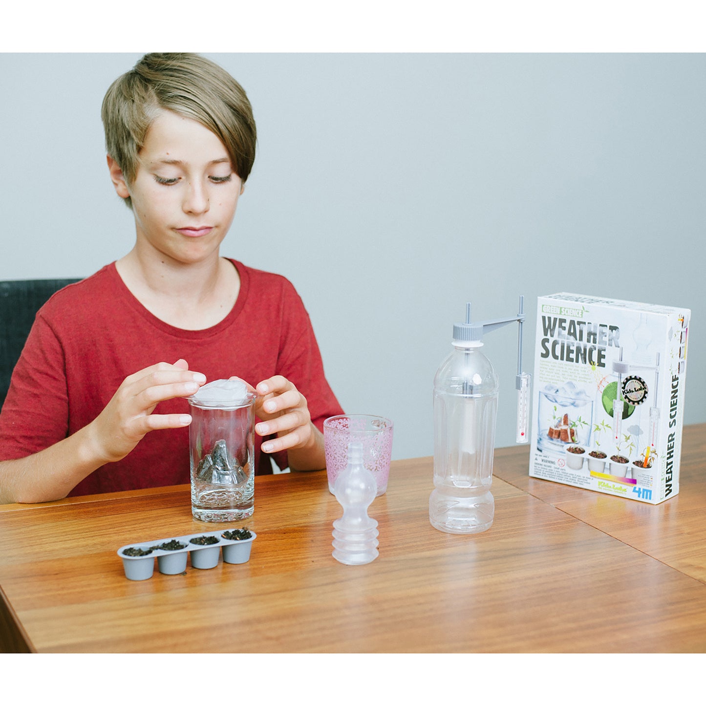 Green Science Weather Science kit with child conducting water experiment
