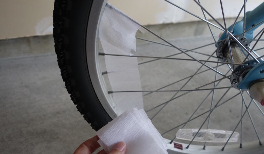 white crepe streamer inside bike wheel spokes
